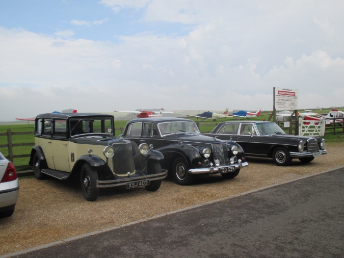 AS cars outside jigsaw workshop